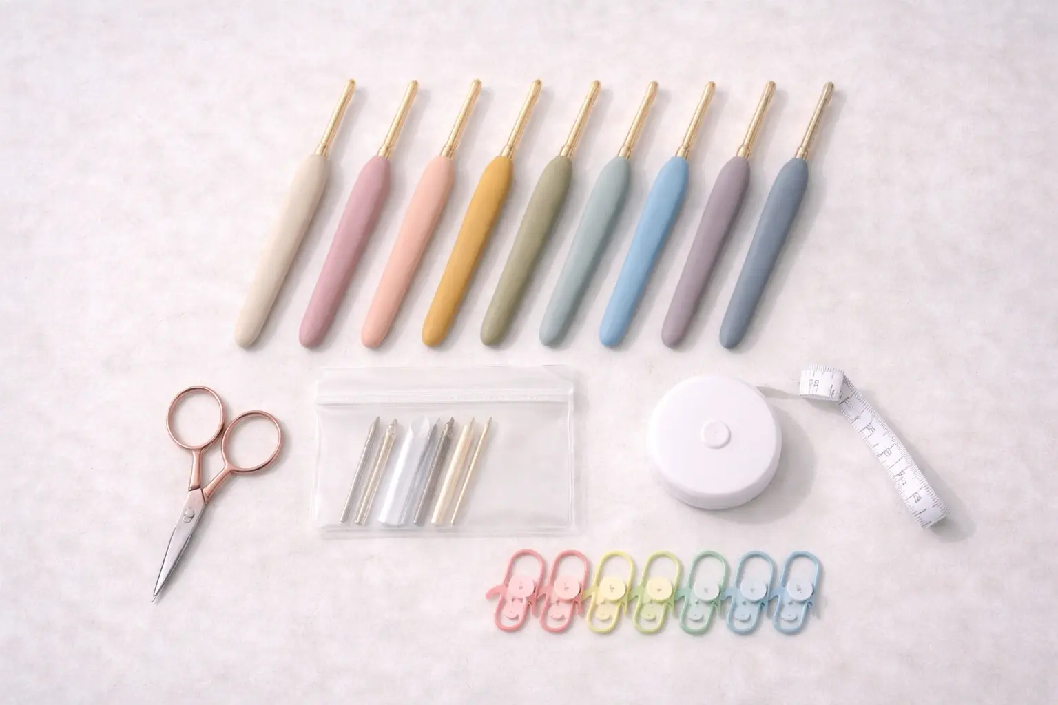 Crochet hooks and tool accessories arranged as a custom tool kit set