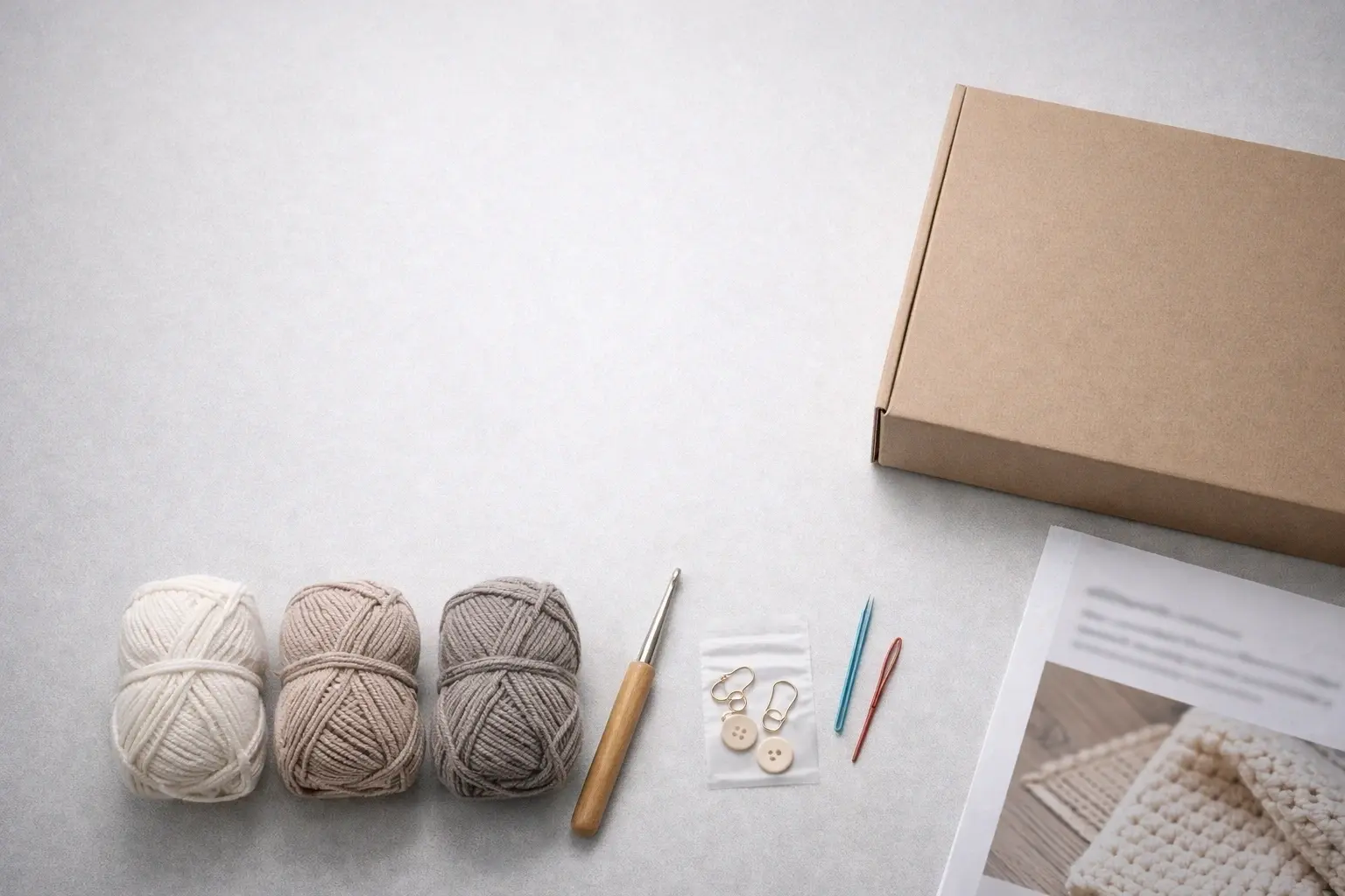 OEM DIY crochet kit components arranged in a clean minimalist manufacturing background