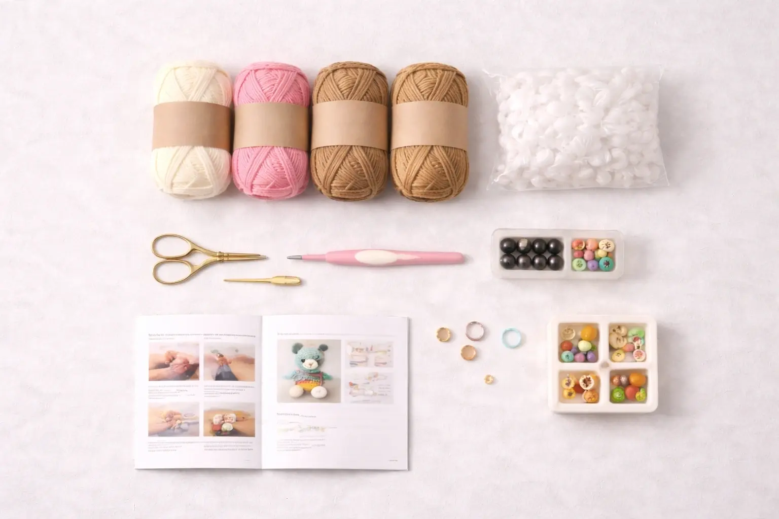 Flat lay of complete beginner crochet kit components for OEM production